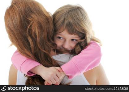 beautiful cheerful girl hugs her young mother. Isolated on white background
