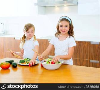 Beautiful chef sisters at home kitchen preparing salad