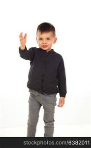Beautiful child indicating something with his hand isolated on a white background