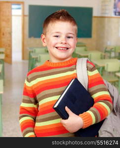 Beautiful child with books and backpack in class