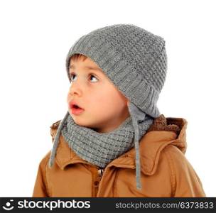 Beautiful child with wool scarf and coat isolated on a white background