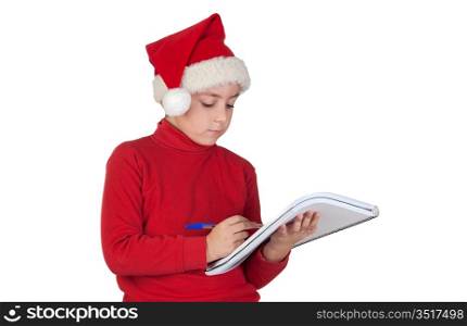Beautiful child writing his Christmas letter to Santa Claus