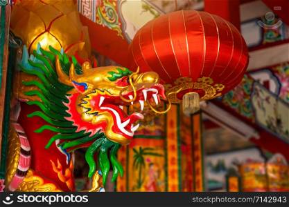 Beautiful Chinese dragons and red lantern on a temple for Chinese New Year Festival at Chinese shrine.