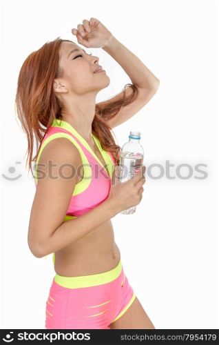 Beautiful Chinese woman with water bottle after workout