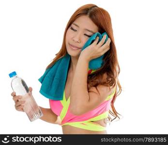 Beautiful Chinese woman with water bottle and towel after workout