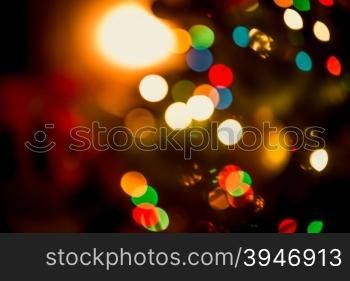 Beautiful Christmas background with blurred glowing colorful lights