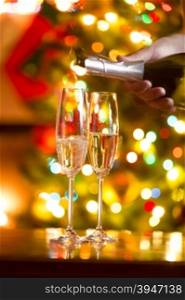 Beautiful Christmas background with glasses of champagne and Christmas tree