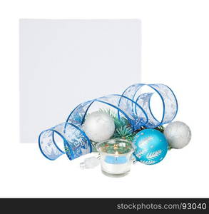 Beautiful Christmas card with burning candle, blue and silver Christmas balls, blue ribbon and fir branches, isolated on a white background, with copy-space