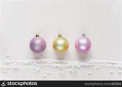 Beautiful Christmas composition with Christmas balls on a pink background. Flat lay composition for greeting cards, websites, social media, magazines, bloggers, artists etc. Christmas wallpaper