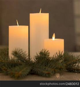 Beautiful Christmas decorations. Candles and a spruce branch. christmas table decoration