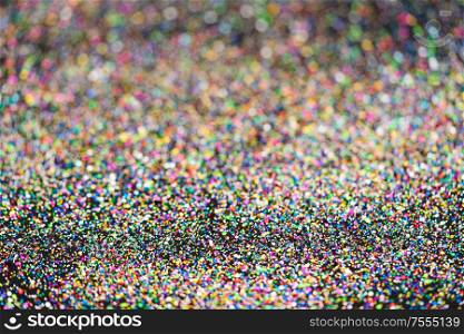 Beautiful Christmas multicolored light background. Abstract glitter bokeh and scattered sparkles , on black. Beautiful Christmas light background. Abstract glitter bokeh and scattered sparkles in gold, on black