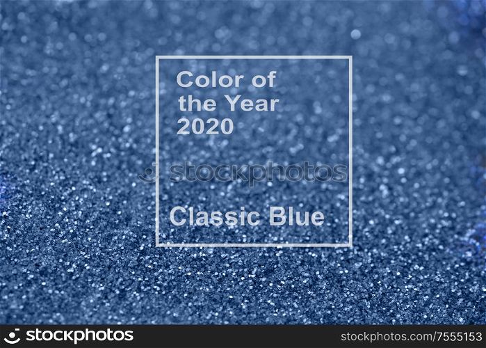 Beautiful Christmas multicolored light background with new 2020 year classic blue color. Abstract classic blue glitter bokeh and scattered sparkles. Beautiful Christmas light background. Abstract glitter bokeh and scattered sparkles in gold, on black