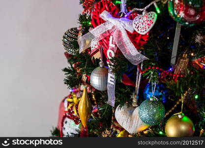 Beautiful Christmas ornaments and decorations hanging in the Christmas tree