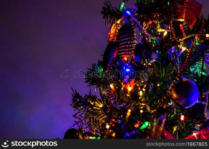 Beautiful Christmas ornaments and lights hanging in the Christmas tree