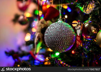 Beautiful Christmas ornaments and lights hanging in the Christmas tree