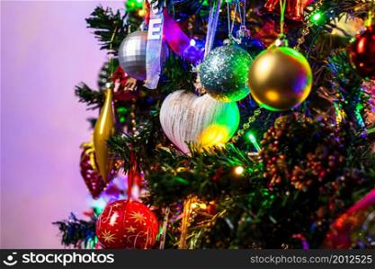 Beautiful Christmas ornaments and lights hanging in the Christmas tree
