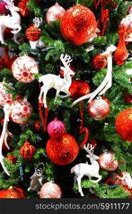 Beautiful christmas tree decor with balls ans deers. Christmas fir decor