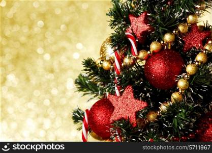 Beautiful christmas tree decorated with baubles and candies
