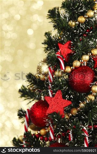 Beautiful christmas tree decorated with baubles and candies