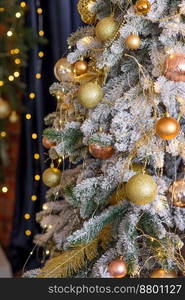 Beautiful Christmas tree with garlands, balls and toys. Preparing your home for the new year