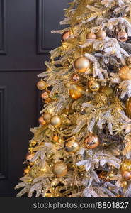 Beautiful Christmas tree with garlands, balls and toys. Preparing your home for the new year