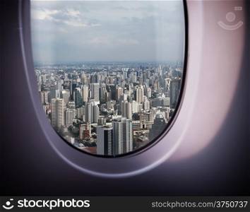 beautiful city view of Bangkok with blue sky from plane window