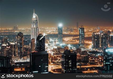 Beautiful Cityscape of a Modern Futuristic Buildings and Towers in the Lights of a Night City. Beauty of Luxury Life of Emirates. Dubai. United Arab Emirates.