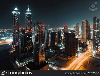 Beautiful Cityscape of a Modern Futuristic Buildings and Towers in the Lights of a Night City. Beauty of Luxury Life of Emirates. Dubai. United Arab Emirates.