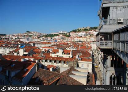 beautiful cityscape of Lisbon with Graca Church, Sao Jorge Castle and Santa Justa Elevator, Portugal (from left to right)