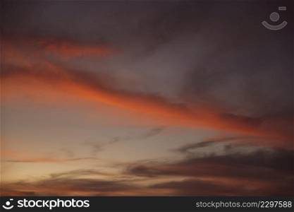 beautiful clouded night sky with red shades