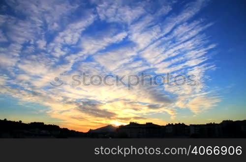 Beautiful clouds at sunset time lapse. Explosion of colors at sunset. Colorful dusk. Dramatic red sky. Awesome clouds at sunset. Spectacular and wonderful sunset.