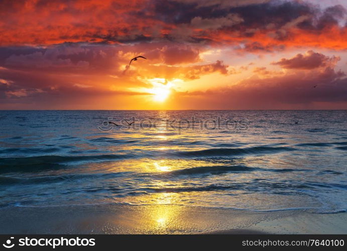 Beautiful cloudscape over the sea at sunrise. Holiday and travel natural background