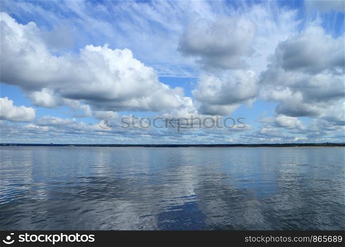 Beautiful cloudy scenery over the sea mirror reflection