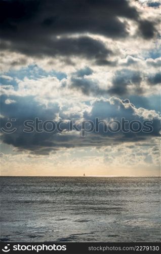 Beautiful cloudy seascape view from a beach at sunset. Cloudy seascape view from a beach at sunset