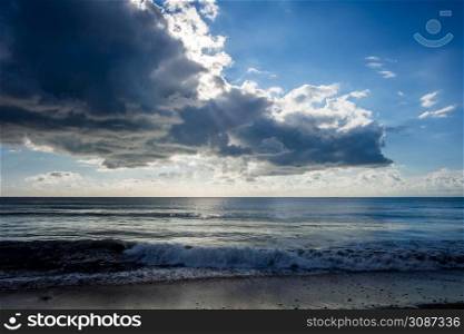 Beautiful cloudy seascape view from a beach at sunset. Cloudy seascape view from a beach at sunset