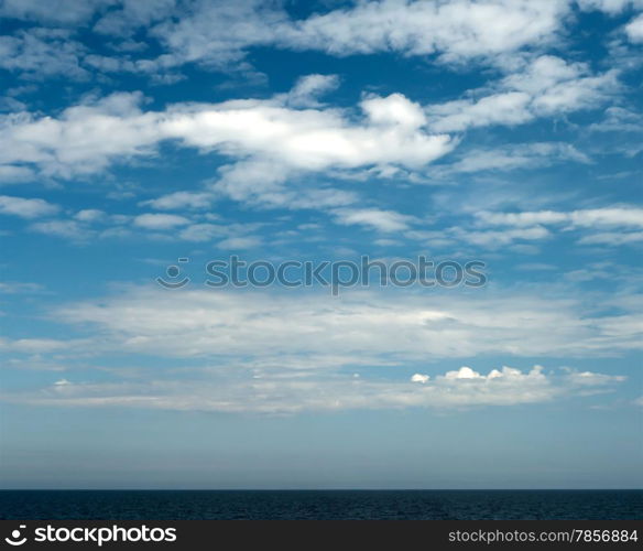 Beautiful cloudy Sky and thin stripe of the Sea.