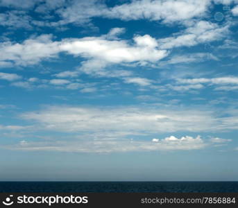 Beautiful cloudy Sky and thin stripe of the Sea.