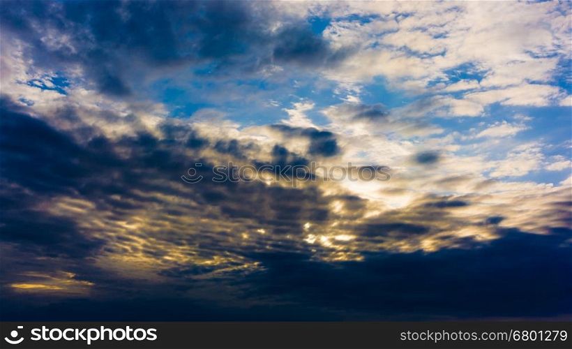Beautiful cloudy sky with sun rays. Dramatic sky with stormy clouds