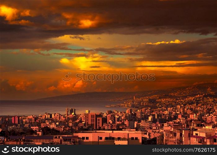 Beautiful coastal city on sunset, amazing view of a town stretches from the mountains to the sea, amazing panoramic view, Lebanon