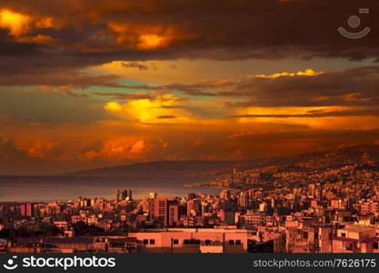 Beautiful coastal city on sunset, amazing view of a town stretches from the mountains to the sea, amazing panoramic view, Lebanon