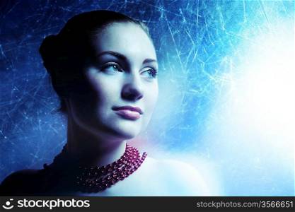 beautiful cold woman on metallic background