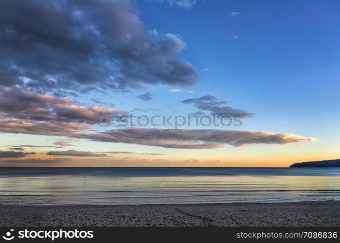 Beautiful colorful clouds over the sea. Amazing sky after sunset.