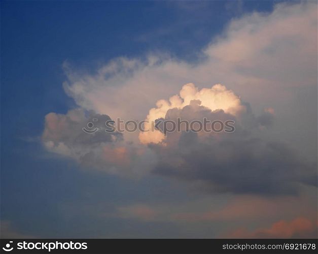 Beautiful colorful cloudscape with cumulus clouds at dusk time