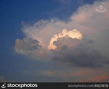 Beautiful colorful cloudscape with cumulus clouds at dusk time