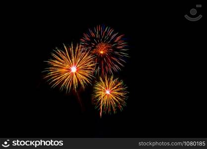 Beautiful colorful fireworks display on the sea beach, Amazing holiday fireworks party or any celebration event in the dark sky.. Beautiful colorful fireworks display on the sea beach.