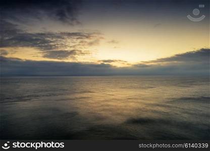 Beautiful colorful sunrise landscape over calm sea