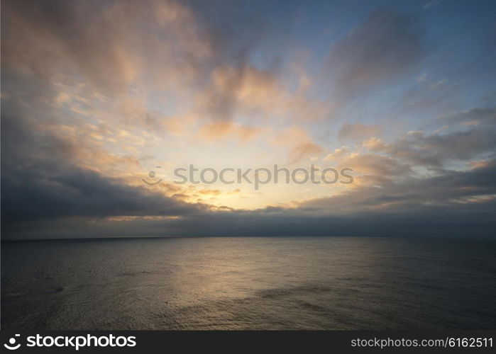 Beautiful colorful sunrise landscape over calm sea