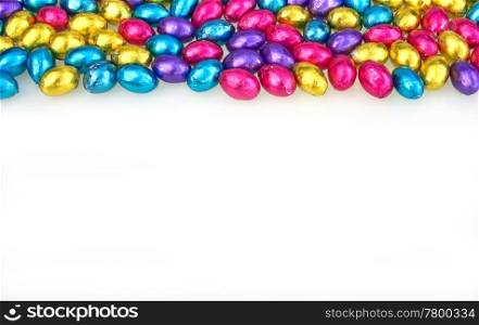 beautiful coloured chocolate easter eggs on white. easter eggs