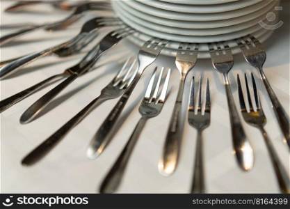 beautiful composition with forks and plates on a buffet table