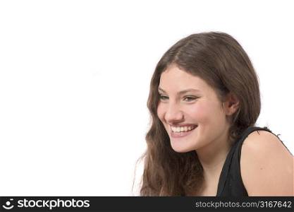 Beautiful confident teenager on white background laughing
